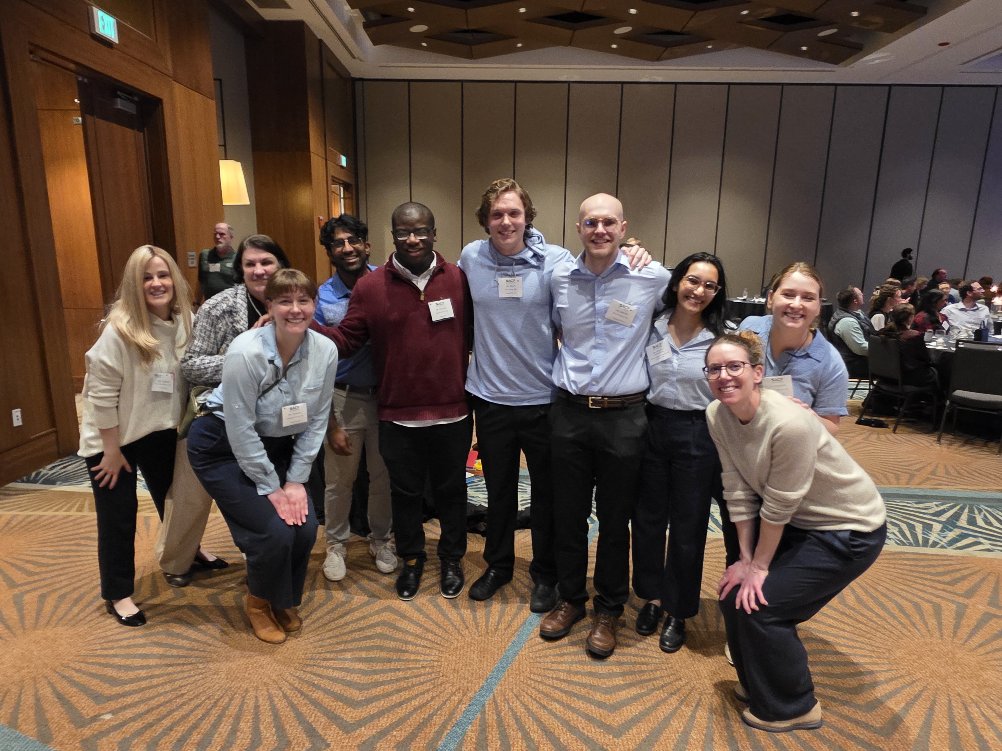 A group of UNC attendees gather to support their team in the Doctor's Dilemma