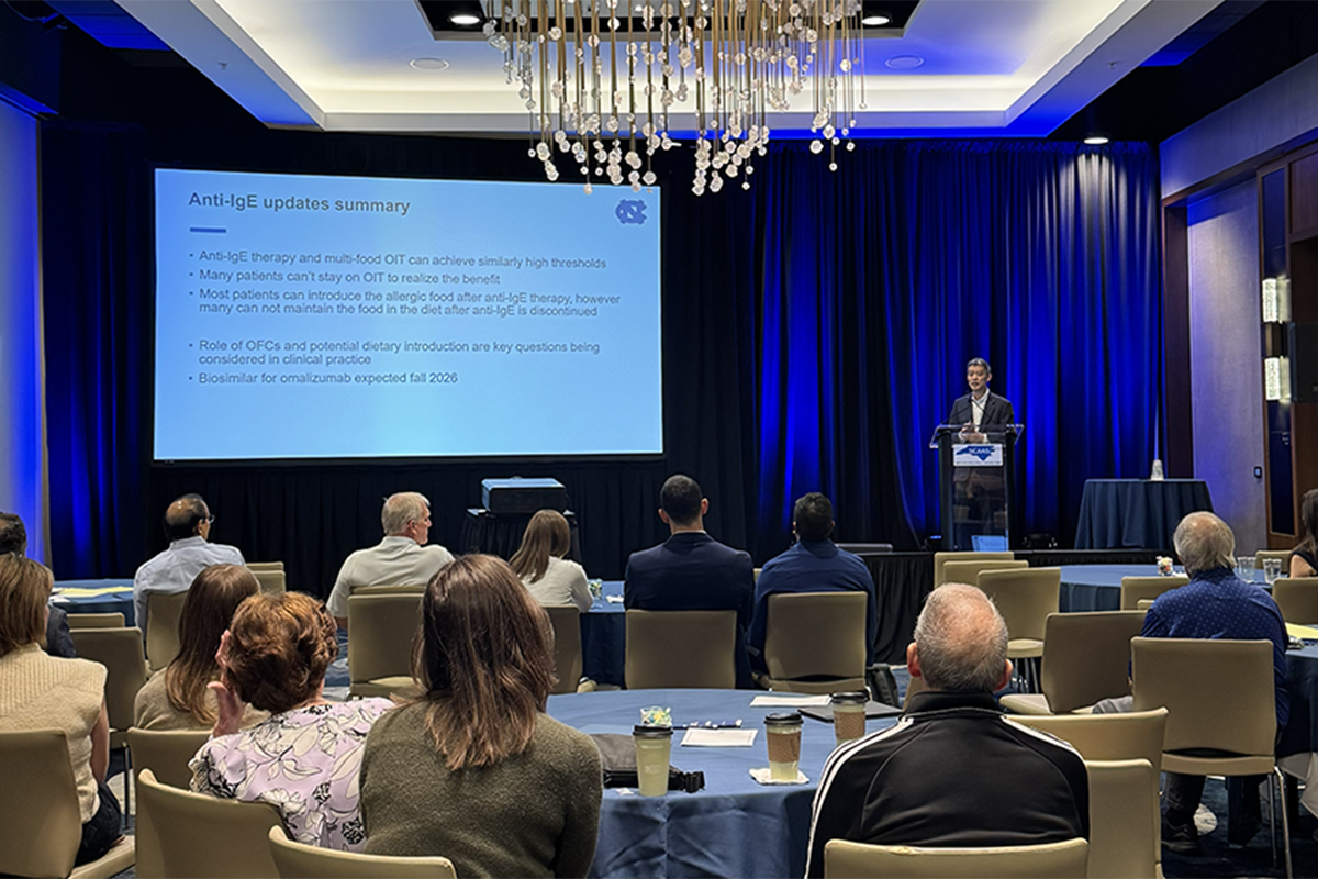 Conference room with Edwin Kim, MD at the podium