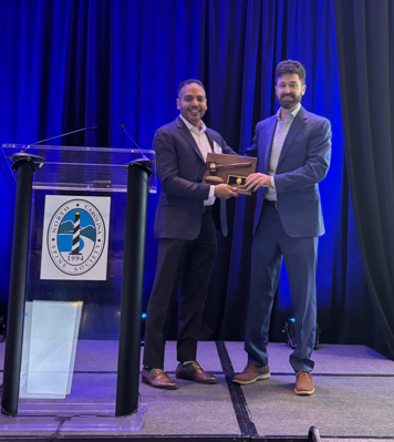 Muhammad M. Abd-El-Barr, MD, PhD, FAANS (left) receives his plaque for serving as NCSS president