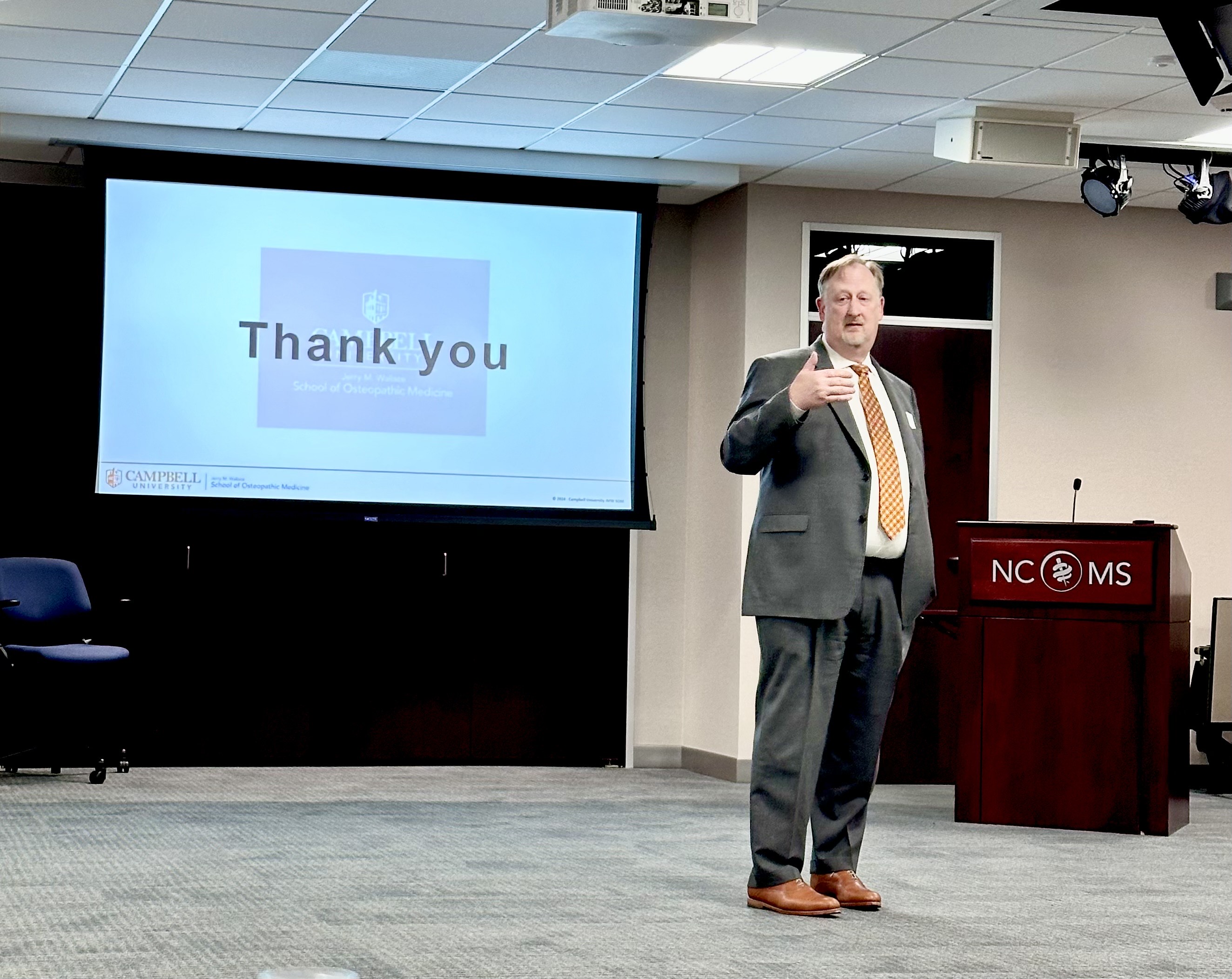 WCMS October 2024 meeting - photo of speaker in front of podium